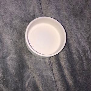 Just a small ceramic ash try. can hold jewelry,ash,rocks,lighters,etc.